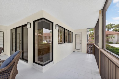 Enjoy effortless living in this beautifully remodeled 2-bedroom on PGA National Golf Club in Florida - for sale on GolfHomes.com, golf home, golf lot