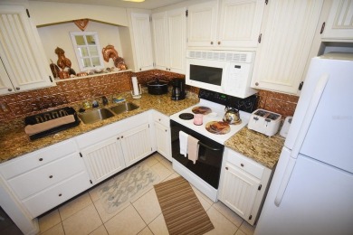 Rarely available ground floor end unit. Easy access to Sharkey's on Lake Venice Golf Club in Florida - for sale on GolfHomes.com, golf home, golf lot