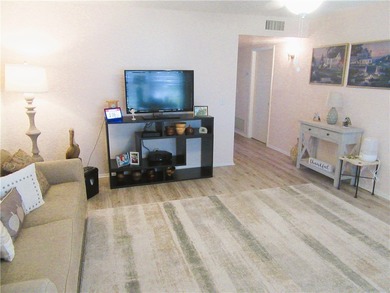 Clean and bright FIRST FLOOR 2/2 condo in wooded golf community on Vero Beach South Golf Course in Florida - for sale on GolfHomes.com, golf home, golf lot