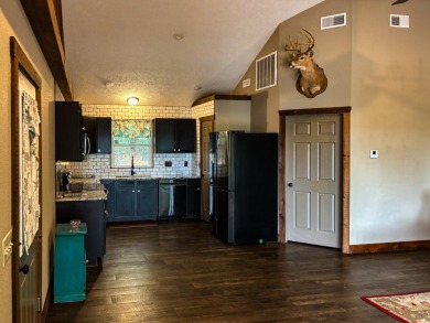 This 3 bedroom, 3 bath home sits on 6 lots in Country Club Hills on Lost Woods Golf Course in Missouri - for sale on GolfHomes.com, golf home, golf lot