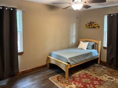 This 3 bedroom, 3 bath home sits on 6 lots in Country Club Hills on Lost Woods Golf Course in Missouri - for sale on GolfHomes.com, golf home, golf lot