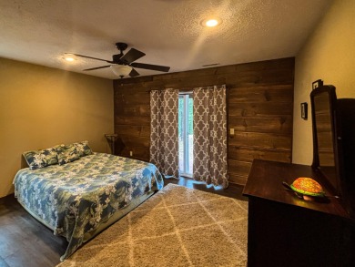 This 3 bedroom, 3 bath home sits on 6 lots in Country Club Hills on Lost Woods Golf Course in Missouri - for sale on GolfHomes.com, golf home, golf lot
