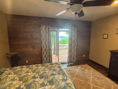 This 3 bedroom, 3 bath home sits on 6 lots in Country Club Hills on Lost Woods Golf Course in Missouri - for sale on GolfHomes.com, golf home, golf lot