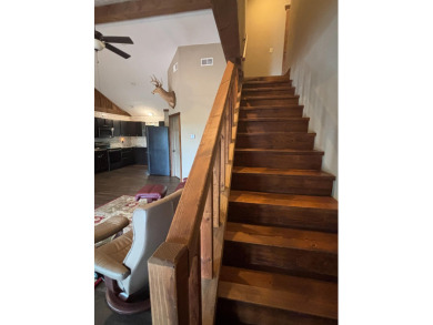 This 3 bedroom, 3 bath home sits on 6 lots in Country Club Hills on Lost Woods Golf Course in Missouri - for sale on GolfHomes.com, golf home, golf lot
