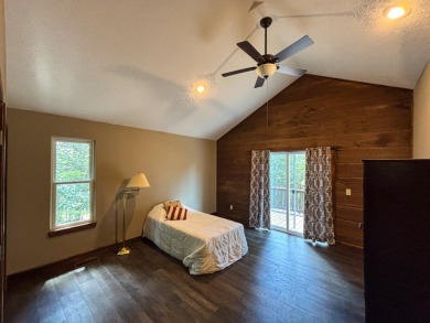This 3 bedroom, 3 bath home sits on 6 lots in Country Club Hills on Lost Woods Golf Course in Missouri - for sale on GolfHomes.com, golf home, golf lot