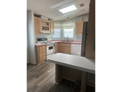Charming 2-Bedroom PH Home  - Almost Fully Furnished & Golf Cart on Schalamar Creek Golf and Country Club in Florida - for sale on GolfHomes.com, golf home, golf lot
