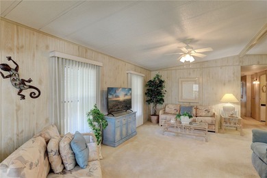 Furnished beauty just steps from the golf course! This on Barefoot Bay Golf Course in Florida - for sale on GolfHomes.com, golf home, golf lot