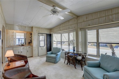 Furnished beauty just steps from the golf course! This on Barefoot Bay Golf Course in Florida - for sale on GolfHomes.com, golf home, golf lot