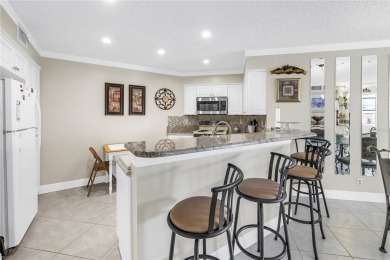This ground-floor, 2-bedroom, 2-bath condo in Isla Del Sol on Isla Del Sol Yacht and Country Club in Florida - for sale on GolfHomes.com, golf home, golf lot