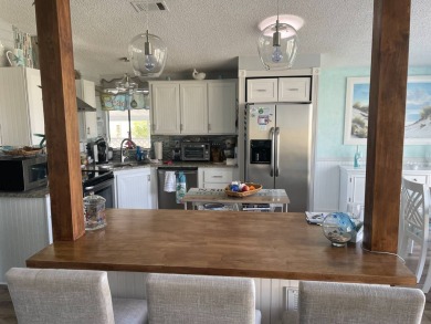 TIRED OF SNOW, ICE AND COLD, MIGHT BE TIME TO START THINKING SUN on Pine Lakes Country Club in Florida - for sale on GolfHomes.com, golf home, golf lot