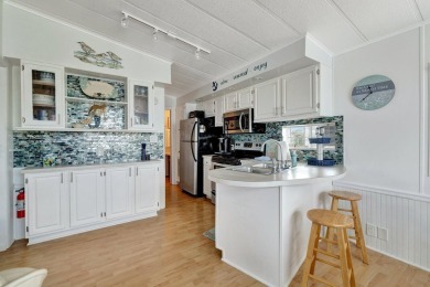 Welcome to The Salty Mermaid, a charming 2-bedroom, 1-bathroom on Island Dunes Country Club in Florida - for sale on GolfHomes.com, golf home, golf lot