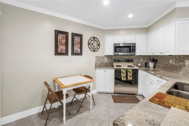 This ground-floor, 2-bedroom, 2-bath condo in Isla Del Sol on Isla Del Sol Yacht and Country Club in Florida - for sale on GolfHomes.com, golf home, golf lot