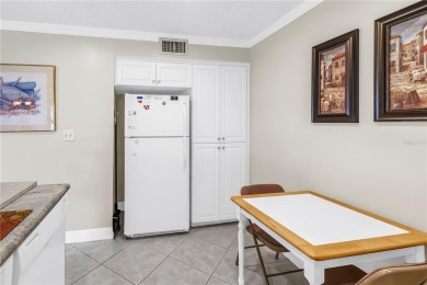 This ground-floor, 2-bedroom, 2-bath condo in Isla Del Sol on Isla Del Sol Yacht and Country Club in Florida - for sale on GolfHomes.com, golf home, golf lot