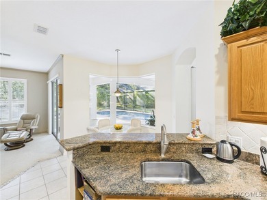 Beautiful Pool Home in Rainbow Springs Country Club Nestled in on Rainbow Springs Golf and Country Club in Florida - for sale on GolfHomes.com, golf home, golf lot