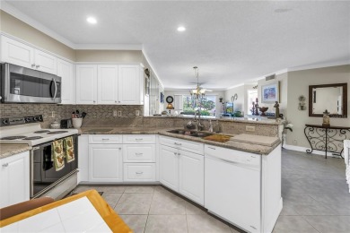 This ground-floor, 2-bedroom, 2-bath condo in Isla Del Sol on Isla Del Sol Yacht and Country Club in Florida - for sale on GolfHomes.com, golf home, golf lot