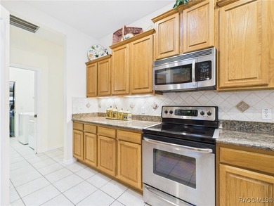 Beautiful Pool Home in Rainbow Springs Country Club Nestled in on Rainbow Springs Golf and Country Club in Florida - for sale on GolfHomes.com, golf home, golf lot