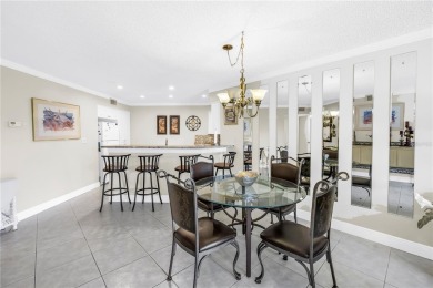 This ground-floor, 2-bedroom, 2-bath condo in Isla Del Sol on Isla Del Sol Yacht and Country Club in Florida - for sale on GolfHomes.com, golf home, golf lot