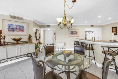 This ground-floor, 2-bedroom, 2-bath condo in Isla Del Sol on Isla Del Sol Yacht and Country Club in Florida - for sale on GolfHomes.com, golf home, golf lot