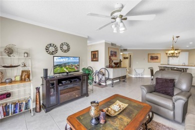 This ground-floor, 2-bedroom, 2-bath condo in Isla Del Sol on Isla Del Sol Yacht and Country Club in Florida - for sale on GolfHomes.com, golf home, golf lot