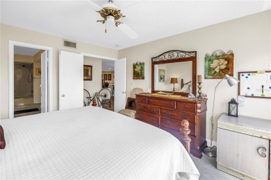 This ground-floor, 2-bedroom, 2-bath condo in Isla Del Sol on Isla Del Sol Yacht and Country Club in Florida - for sale on GolfHomes.com, golf home, golf lot