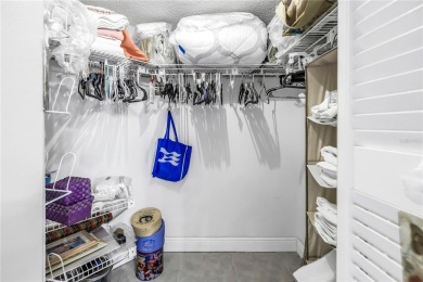 This ground-floor, 2-bedroom, 2-bath condo in Isla Del Sol on Isla Del Sol Yacht and Country Club in Florida - for sale on GolfHomes.com, golf home, golf lot