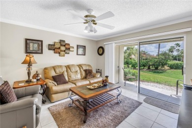 This ground-floor, 2-bedroom, 2-bath condo in Isla Del Sol on Isla Del Sol Yacht and Country Club in Florida - for sale on GolfHomes.com, golf home, golf lot