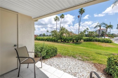 This ground-floor, 2-bedroom, 2-bath condo in Isla Del Sol on Isla Del Sol Yacht and Country Club in Florida - for sale on GolfHomes.com, golf home, golf lot