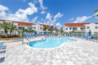 This ground-floor, 2-bedroom, 2-bath condo in Isla Del Sol on Isla Del Sol Yacht and Country Club in Florida - for sale on GolfHomes.com, golf home, golf lot