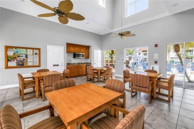 This ground-floor, 2-bedroom, 2-bath condo in Isla Del Sol on Isla Del Sol Yacht and Country Club in Florida - for sale on GolfHomes.com, golf home, golf lot