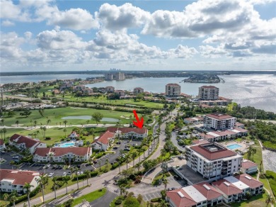 This ground-floor, 2-bedroom, 2-bath condo in Isla Del Sol on Isla Del Sol Yacht and Country Club in Florida - for sale on GolfHomes.com, golf home, golf lot