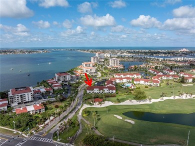 This ground-floor, 2-bedroom, 2-bath condo in Isla Del Sol on Isla Del Sol Yacht and Country Club in Florida - for sale on GolfHomes.com, golf home, golf lot
