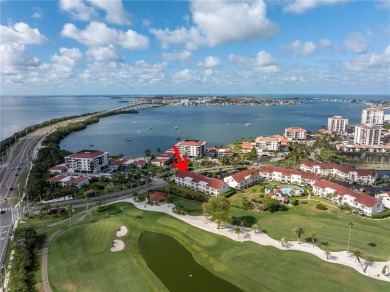 This ground-floor, 2-bedroom, 2-bath condo in Isla Del Sol on Isla Del Sol Yacht and Country Club in Florida - for sale on GolfHomes.com, golf home, golf lot