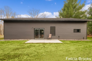 Welcome home to this recently completed bardominium style home - on Tullymore Golf Club in Michigan - for sale on GolfHomes.com, golf home, golf lot