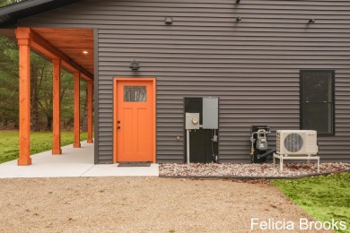 Welcome home to this recently completed bardominium style home - on Tullymore Golf Club in Michigan - for sale on GolfHomes.com, golf home, golf lot