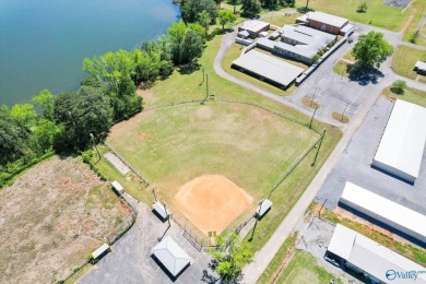 Prime 20-acre waterfront property w/ approx. 2700 feet of main on Gunters Landing in Alabama - for sale on GolfHomes.com, golf home, golf lot