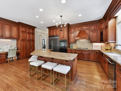 Discover the epitome of luxury living in this stunning executive on Ballantyne Resort and Country Club in North Carolina - for sale on GolfHomes.com, golf home, golf lot