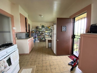 This home has so much character. The open space on the porch is on Hilo Municipal Golf Course in Hawaii - for sale on GolfHomes.com, golf home, golf lot