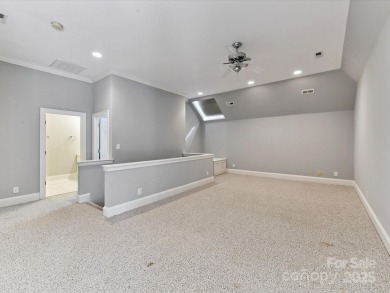 Discover the epitome of luxury living in this stunning executive on Ballantyne Resort and Country Club in North Carolina - for sale on GolfHomes.com, golf home, golf lot