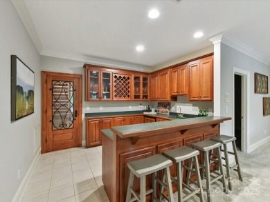 Discover the epitome of luxury living in this stunning executive on Ballantyne Resort and Country Club in North Carolina - for sale on GolfHomes.com, golf home, golf lot