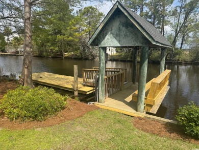 Stunning waterfront property in the neighborhood of Wedgefield on Wedgefield Plantation Golf Club in South Carolina - for sale on GolfHomes.com, golf home, golf lot