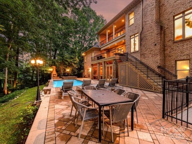 Discover the epitome of luxury living in this stunning executive on Ballantyne Resort and Country Club in North Carolina - for sale on GolfHomes.com, golf home, golf lot