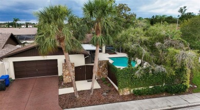 Located on a private corner lot in the highly sought-after on Carrollwood Country Club in Florida - for sale on GolfHomes.com, golf home, golf lot