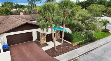 Located on a private corner lot in the highly sought-after on Carrollwood Country Club in Florida - for sale on GolfHomes.com, golf home, golf lot