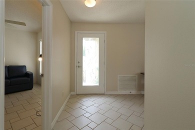 REDUCED PRICE, NOW INCLUDES GOLF CART.  Welcome in to this on The Links of Spruce Creek in Florida - for sale on GolfHomes.com, golf home, golf lot