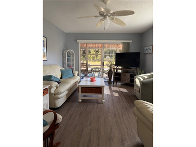 Beautiful first-floor condo in a desirable 55+ community with on The American Golf Club in Florida - for sale on GolfHomes.com, golf home, golf lot