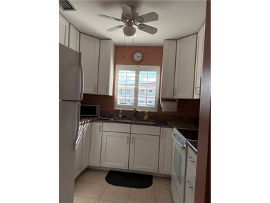 Beautiful first-floor condo in a desirable 55+ community with on The American Golf Club in Florida - for sale on GolfHomes.com, golf home, golf lot