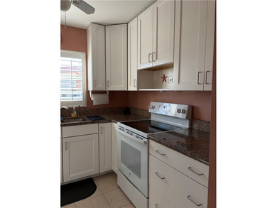 Beautiful first-floor condo in a desirable 55+ community with on The American Golf Club in Florida - for sale on GolfHomes.com, golf home, golf lot