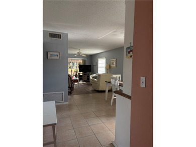 Beautiful first-floor condo in a desirable 55+ community with on The American Golf Club in Florida - for sale on GolfHomes.com, golf home, golf lot