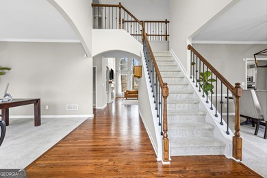 Welcome home to this 6-bedroom, 4-bath home tucked away on a on The Golf Club of Georgia in Georgia - for sale on GolfHomes.com, golf home, golf lot