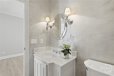 Enjoy panoramic golf course and lagoon views from this beautiful on The Landings Club - Oakridge in Georgia - for sale on GolfHomes.com, golf home, golf lot